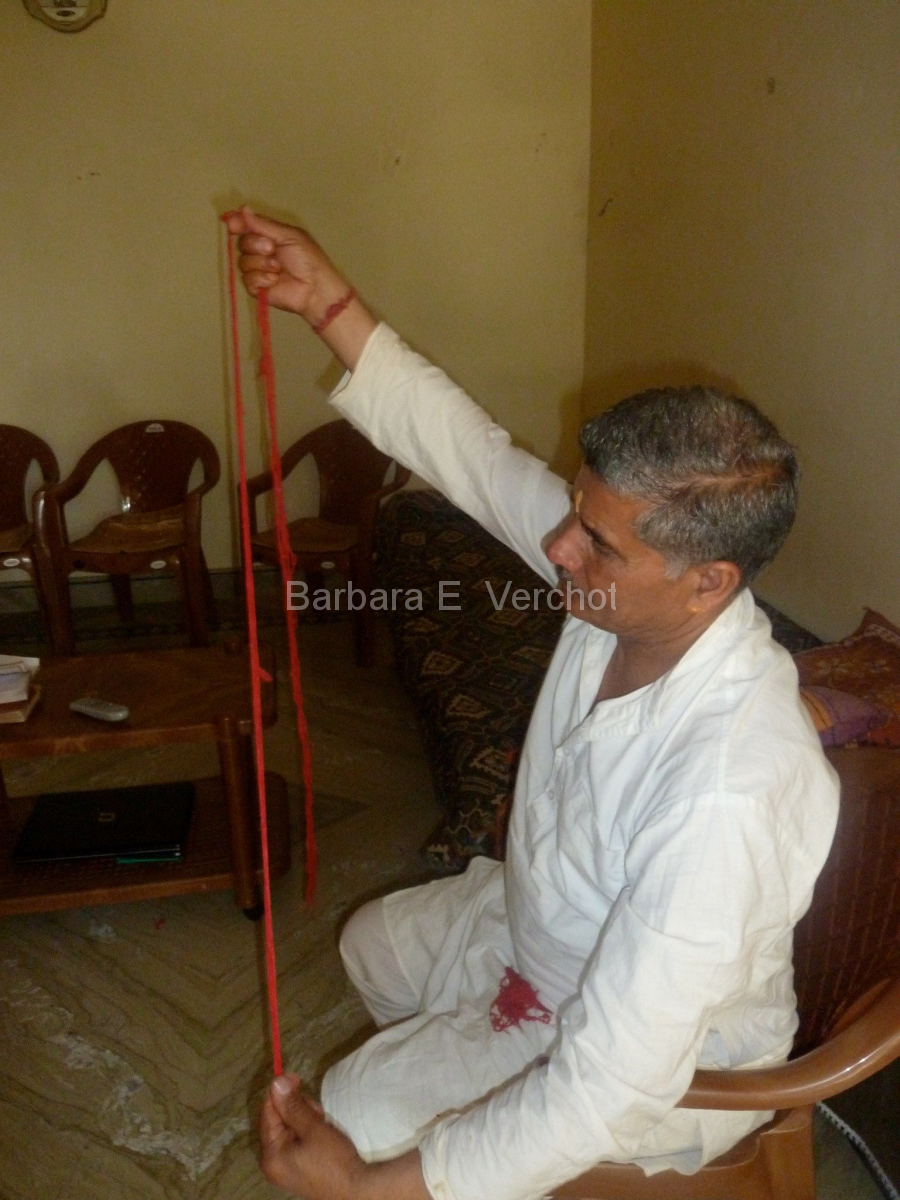 Arun's dad blessed red thread that I was integrating into the collaborative art piece.
